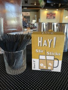 Single-use plastic sticks replaced with natural, sustainable HAY! stir sticks.